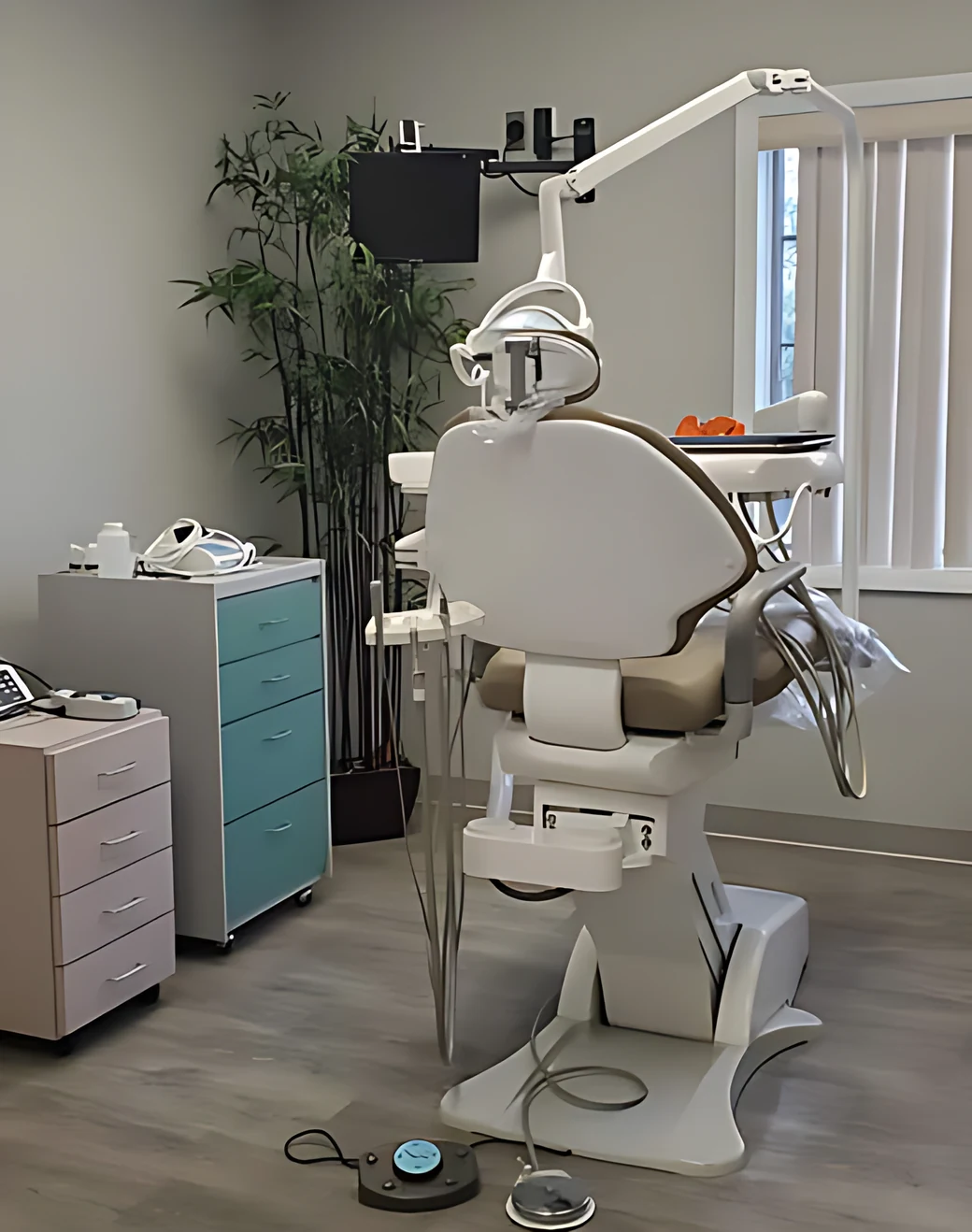A treatment room at Lakeside Dental — dental chair, overhead light and chairside monitor